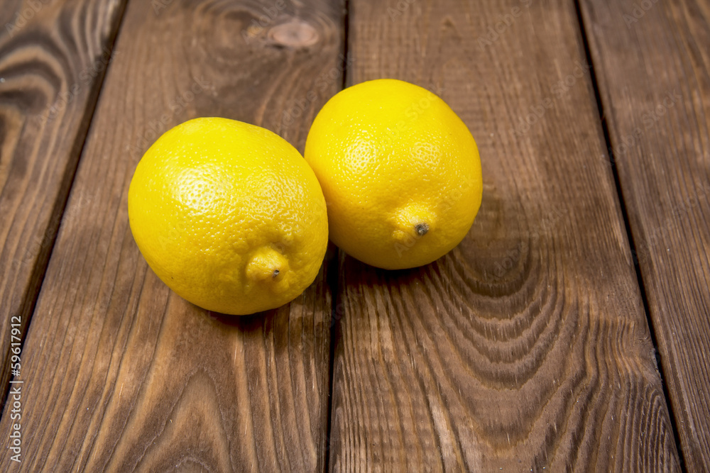 Lemons on a wooden background