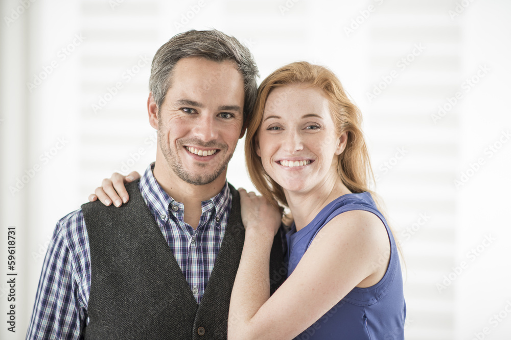 portrait of a beautiful couple looking at camera portrait of a beautiful couple looking at camera