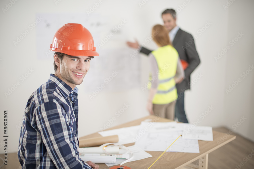 foreman during a meeting about a build project foreman during a meeting about a build project