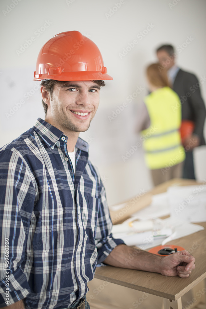 foreman during a meeting about a build project foreman during a meeting about a build project