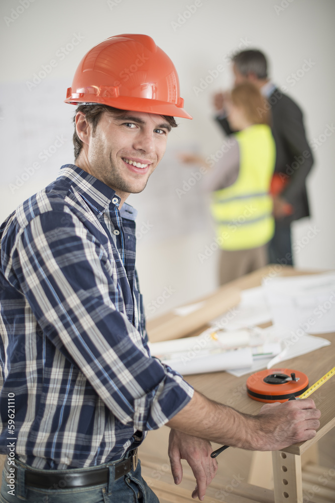 foreman during a meeting about a build project foreman during a meeting about a build project