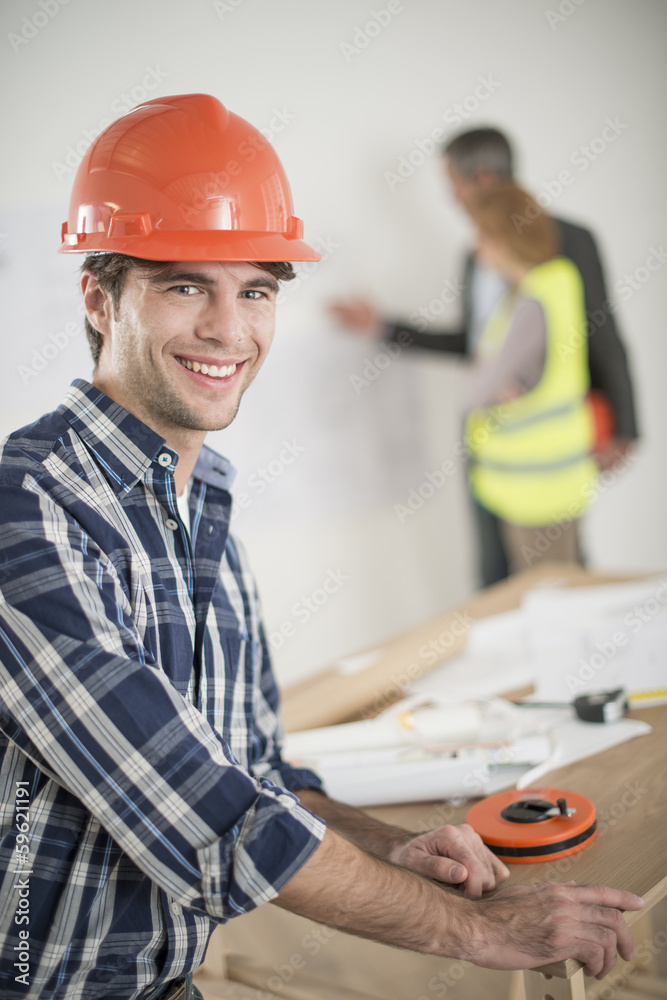 foreman during a meeting about a build project foreman during a meeting about a build project