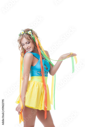 Smiling sexy girl posing in erotic folk dress