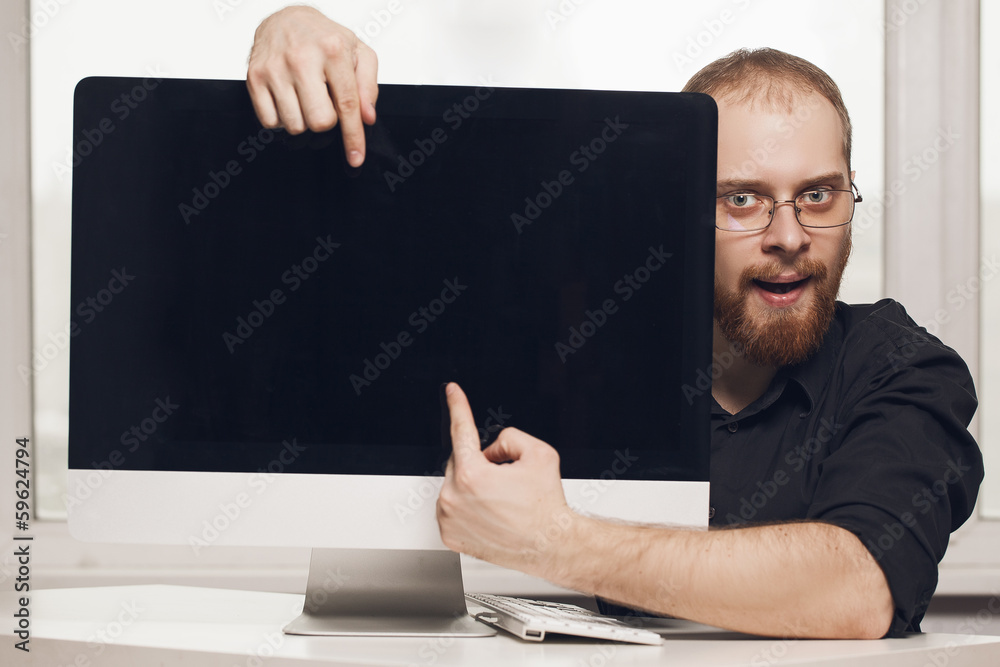 Smiling executive holding a laptop Smiling executive holding a laptop