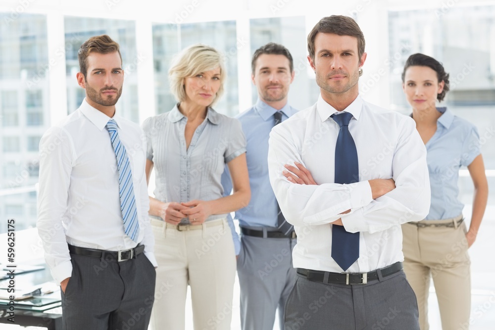 Confident business team standing together Confident business team standing together