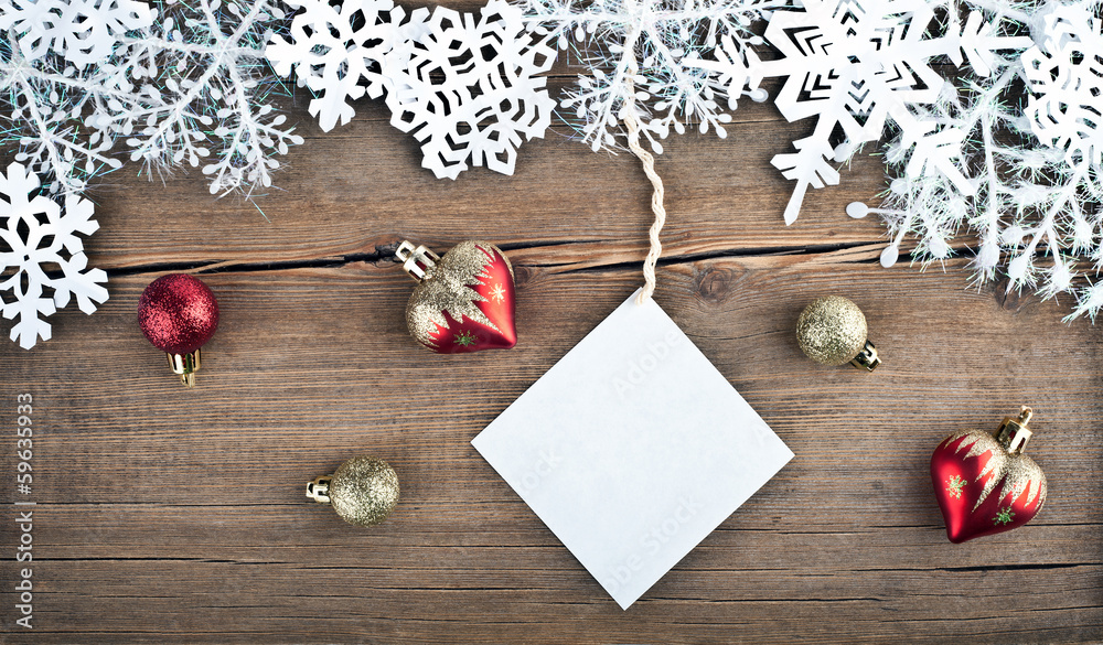 Christmas tree decoration and snowflakes on wooden background Christmas tree decoration and snowflakes on wooden background