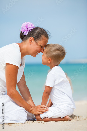 Mother and son having fun on the beach