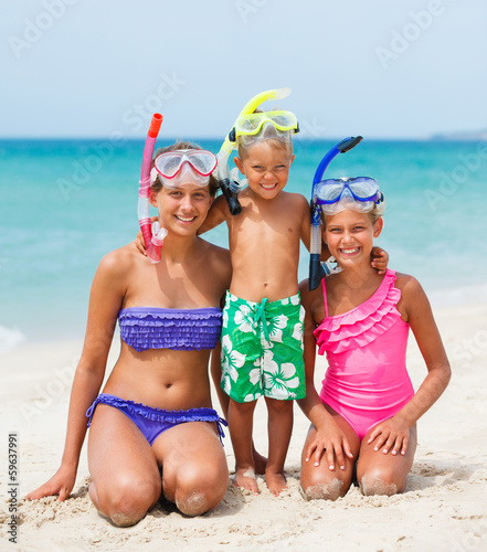 three happy children on beach...