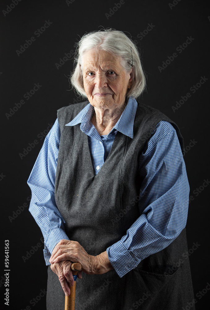 Portrait of a smiling senior woman looking at the camera Portrait of a smiling senior woman looking at the camera