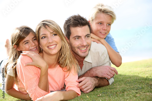 Portrait of happy family in summer time