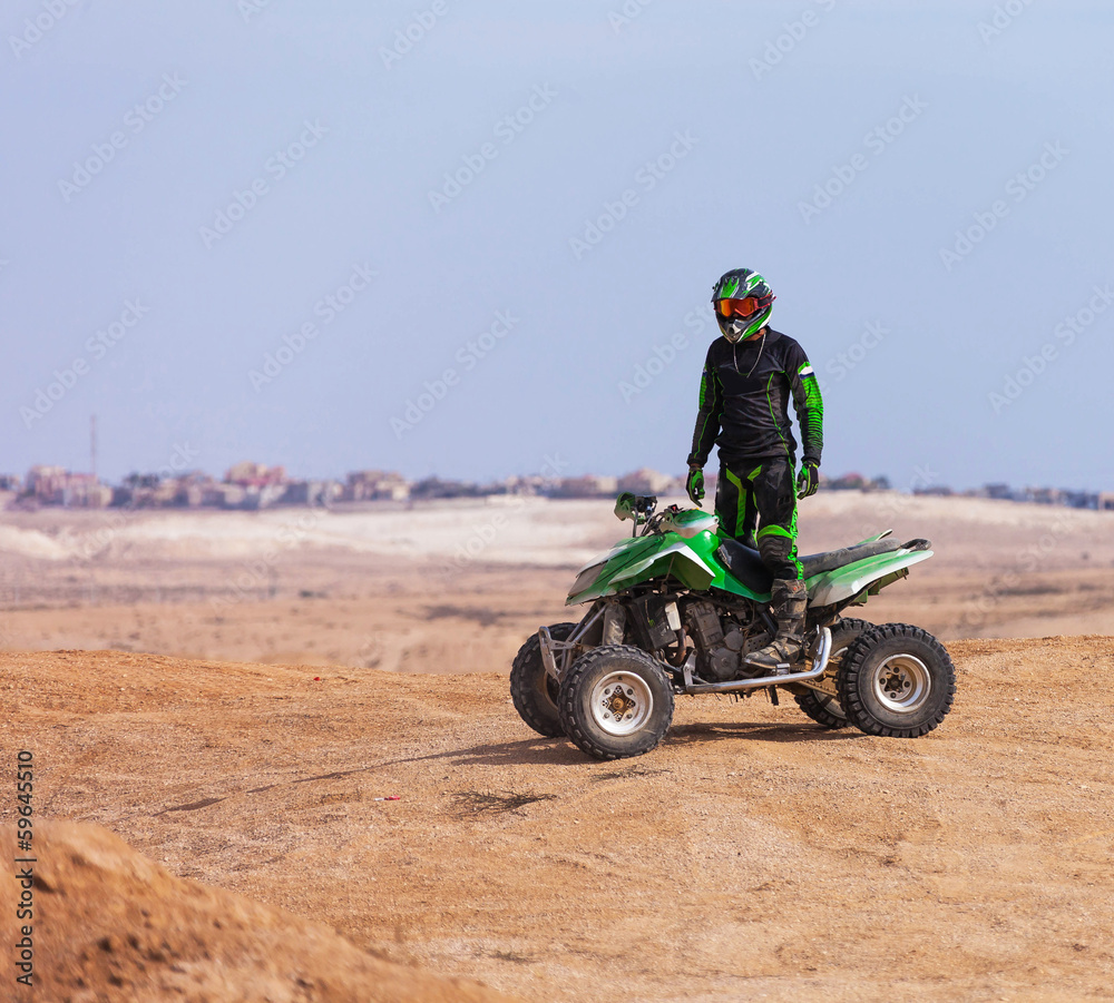 ATV rider in the desert summer ATV rider in the desert summer