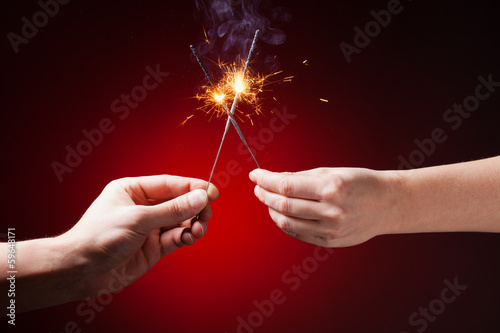 sparklers in hands