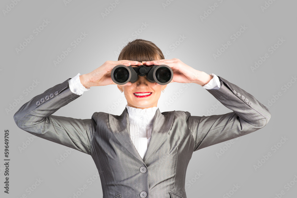 business woman looking through binoculars business woman looking through binoculars