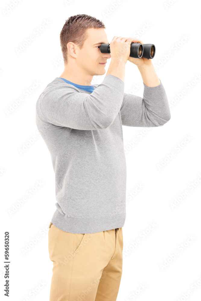Smiling casual man looking through binocular Smiling casual man looking through binocular