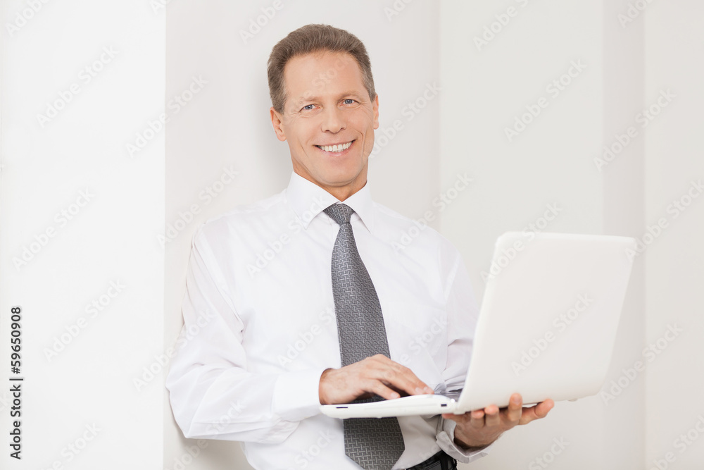 Businessman with laptop. Businessman with laptop.