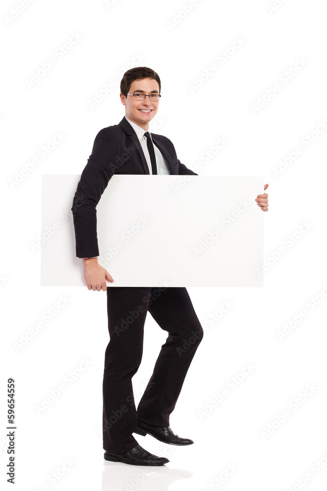 Businessman walks with placard. Businessman walks with placard.