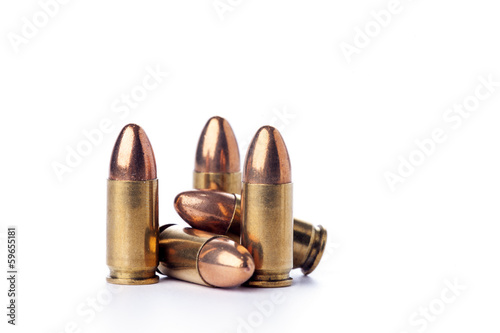 Billede på lærred A group of 9mm bullets for a a gun isolated on white