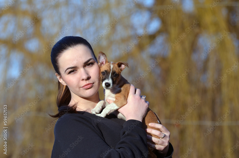 Teen girl with small dog.Near Kiev,Ukraine Teen girl with small dog.Near Kiev,Ukraine
