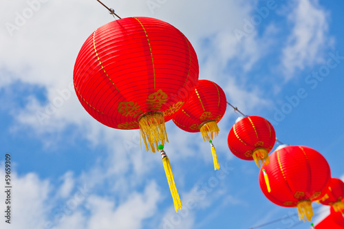 Red Chinese Paper Lanterns against a Blue Sky