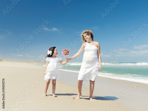 Mother and daughter holding a windmill