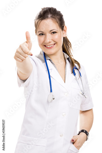 Beautiful young veterinary with thumbs up  isolated over white b