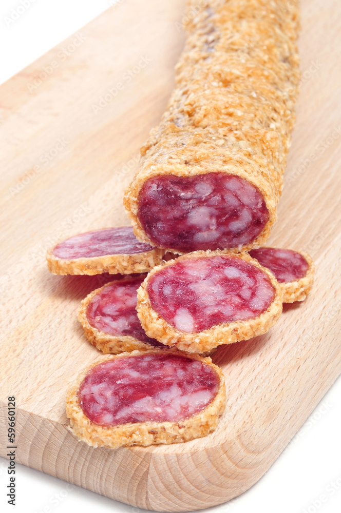 fuet, a spanish sausage, coated with onion fuet, a spanish sausage, coated with onion