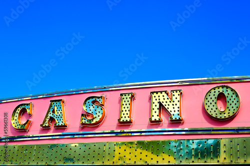 Photography Casino sign over blue sky