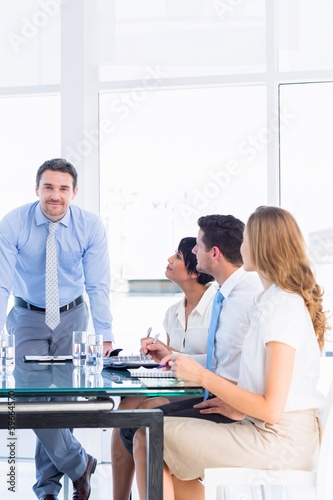 Executives around conference table in office