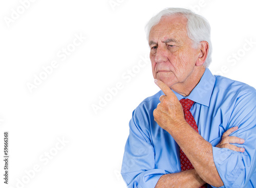 Closeup portrait of old man, deep in thought, daydreaming