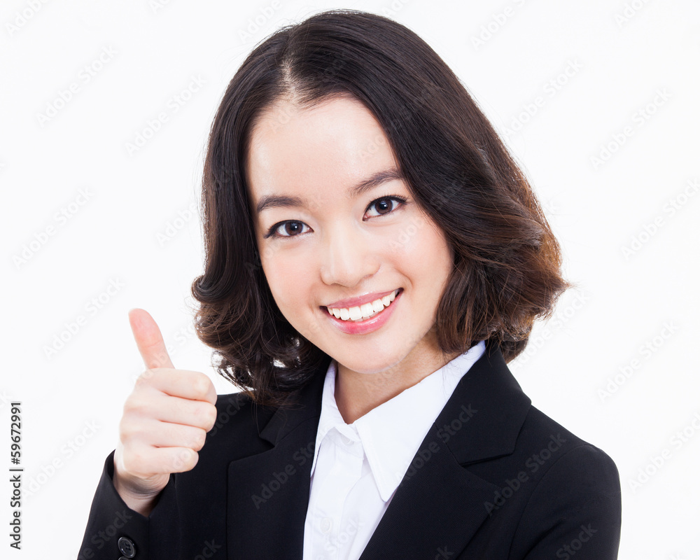 Successful happy Asian businesswoman showing thumb.