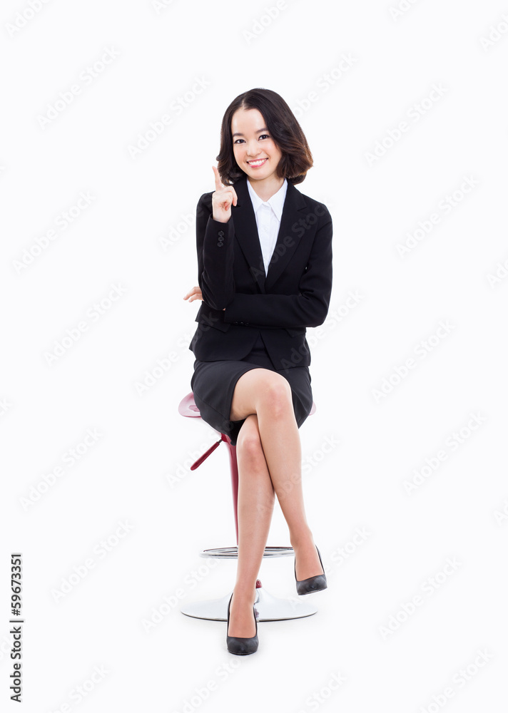 Young Asian business woman sitting on the chair. Young Asian business woman sitting on the chair.
