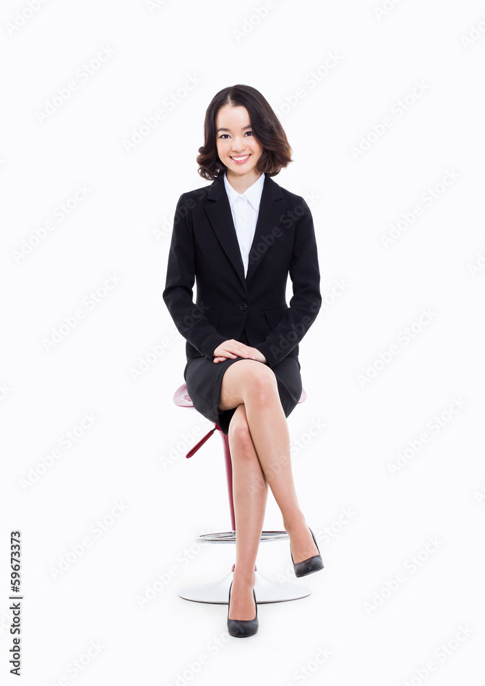 Young Asian business woman sitting on the chair. Young Asian business woman sitting on the chair.