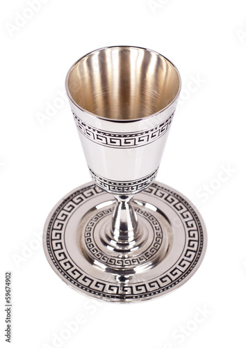 Silver kiddush wine cup and saucer on a white background photo