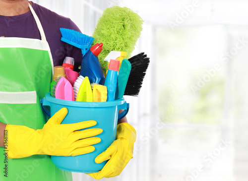 Portrait of young man with cleaning equipment