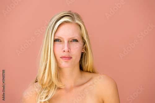 woman closeup portrait with on pink background