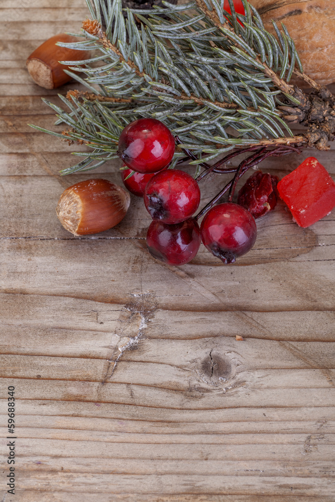traditional holly Christmas tree on a wooden background traditional holly Christmas tree on a wooden background