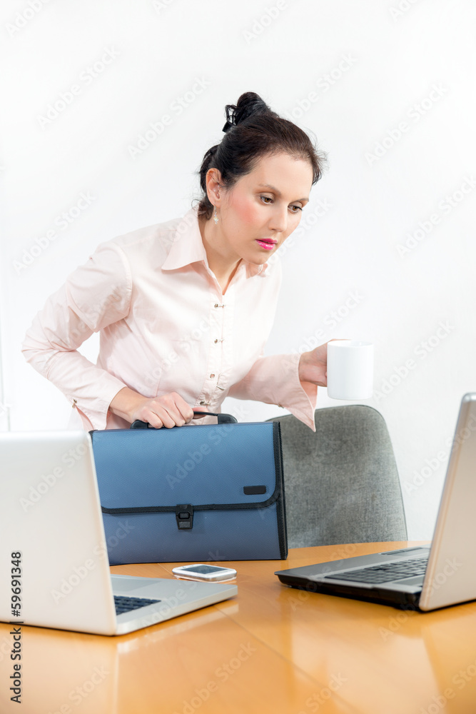 businesswoman holding a cup of coffee and come to work businesswoman holding a cup of coffee and come to work