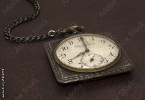 Old worn pocket watch