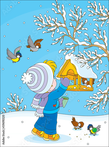 Child feeds small birds