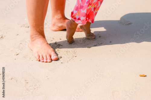 Kid and mom on the beach