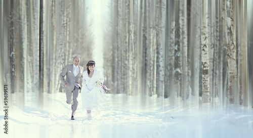 Fototapeta Naklejka Na Ścianę i Meble -  bride and groom in forest