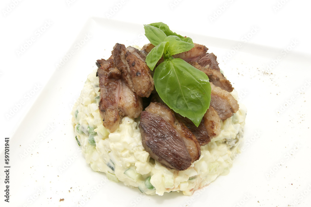 salad with meat on a table in a restaurant