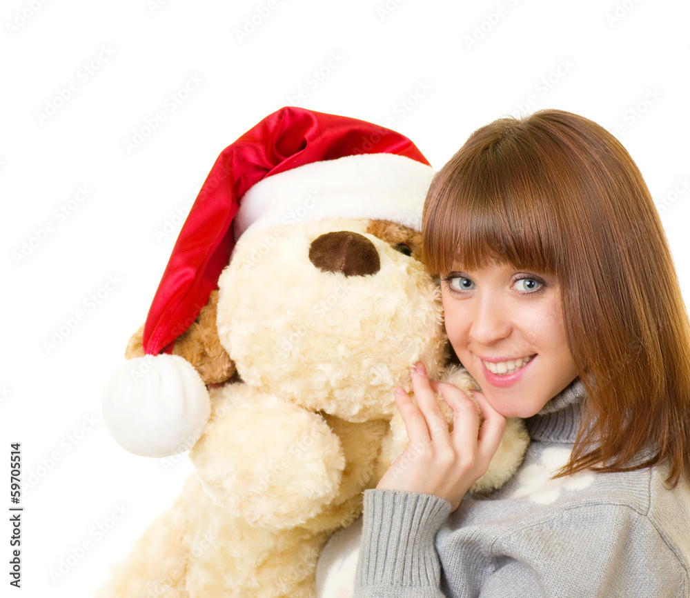 Beautiful young woman in Santa Claus clothes with toy dog Beautiful young woman in Santa Claus clothes with toy dog