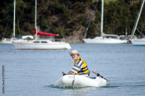Man sails an inflatable boat