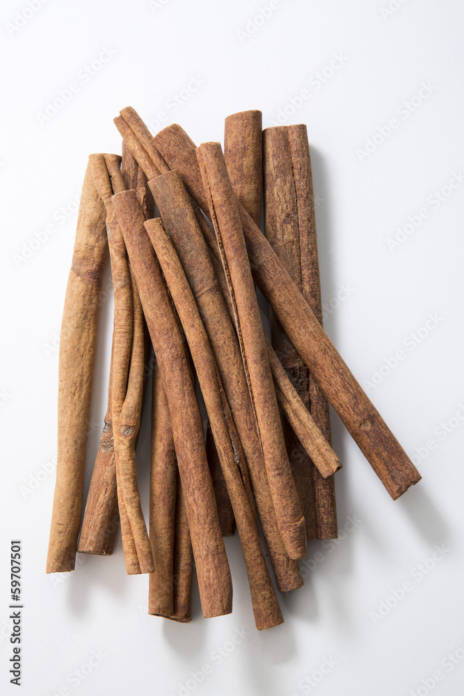 Cinnamons on white table Cinnamons on white table
