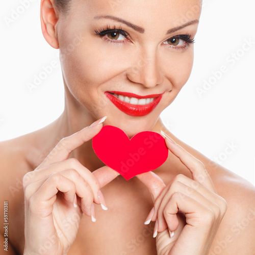 Portrait of a beautiful woman with bright makeup and red heart