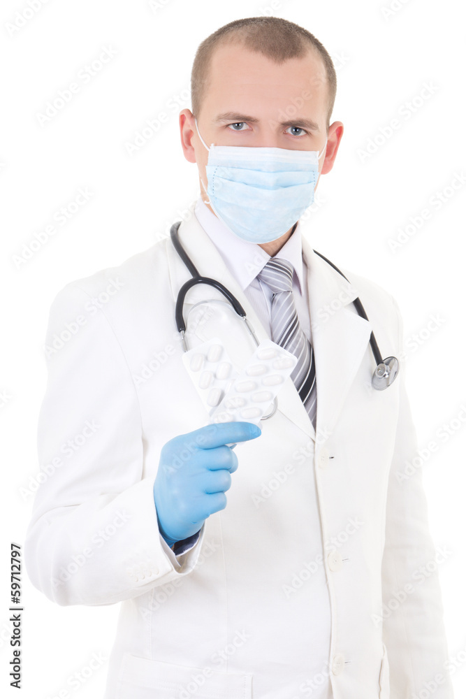 portrait of young doctor in mask with pills in hand isolated on portrait of young doctor in mask with pills in hand isolated on