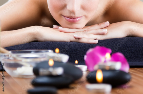 Pretty young woman relaxing at spa