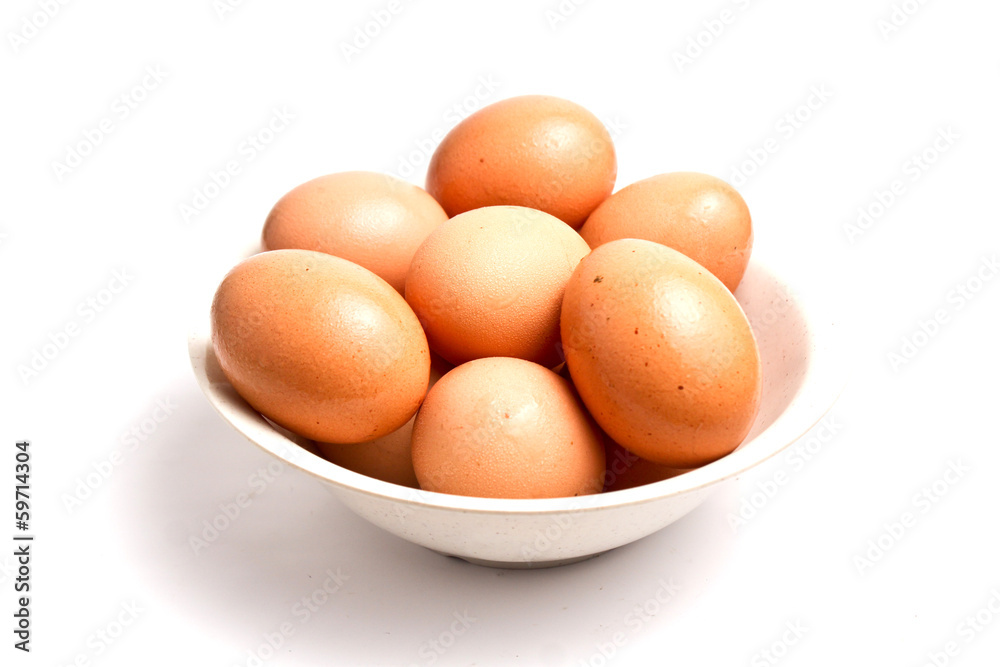 Eggs in a bowl isolated on white Eggs in a bowl isolated on white