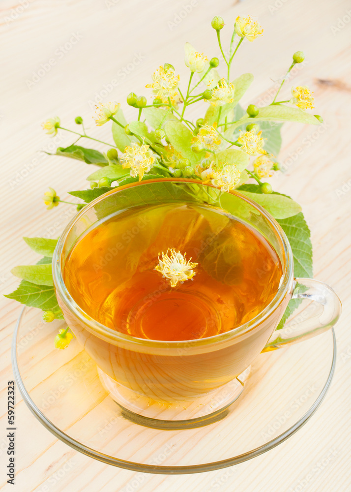 linden flowers and cup of healthy tea, herbal medicine linden flowers and cup of healthy tea, herbal medicine